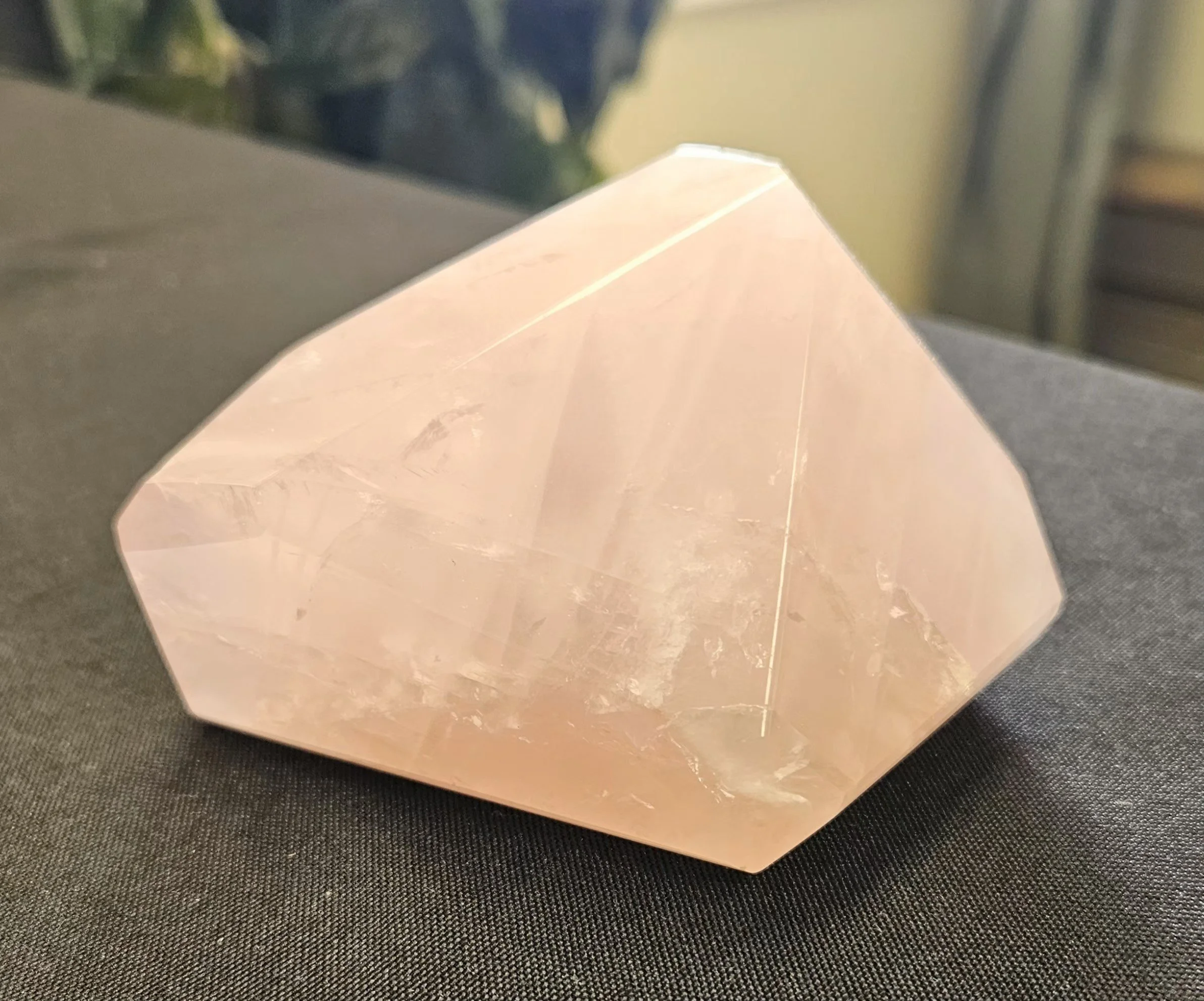 Soft pink rose quartz crystal cluster used for heart chakra healing and unconditional love energy work.