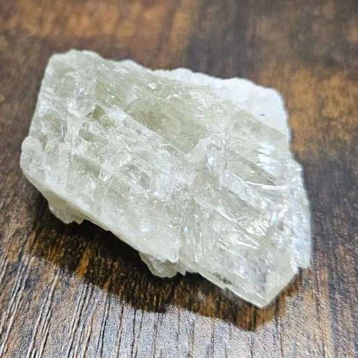 Green hiddenite crystal showing natural spodumene formation and soft translucent colour