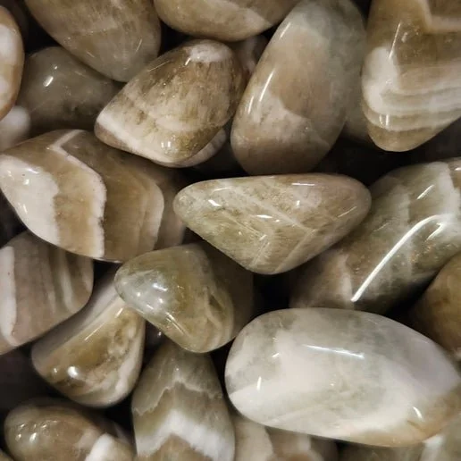 Light green prasiolite quartz point, also known as green amethyst, used for heart chakra healing and spiritual alignment.