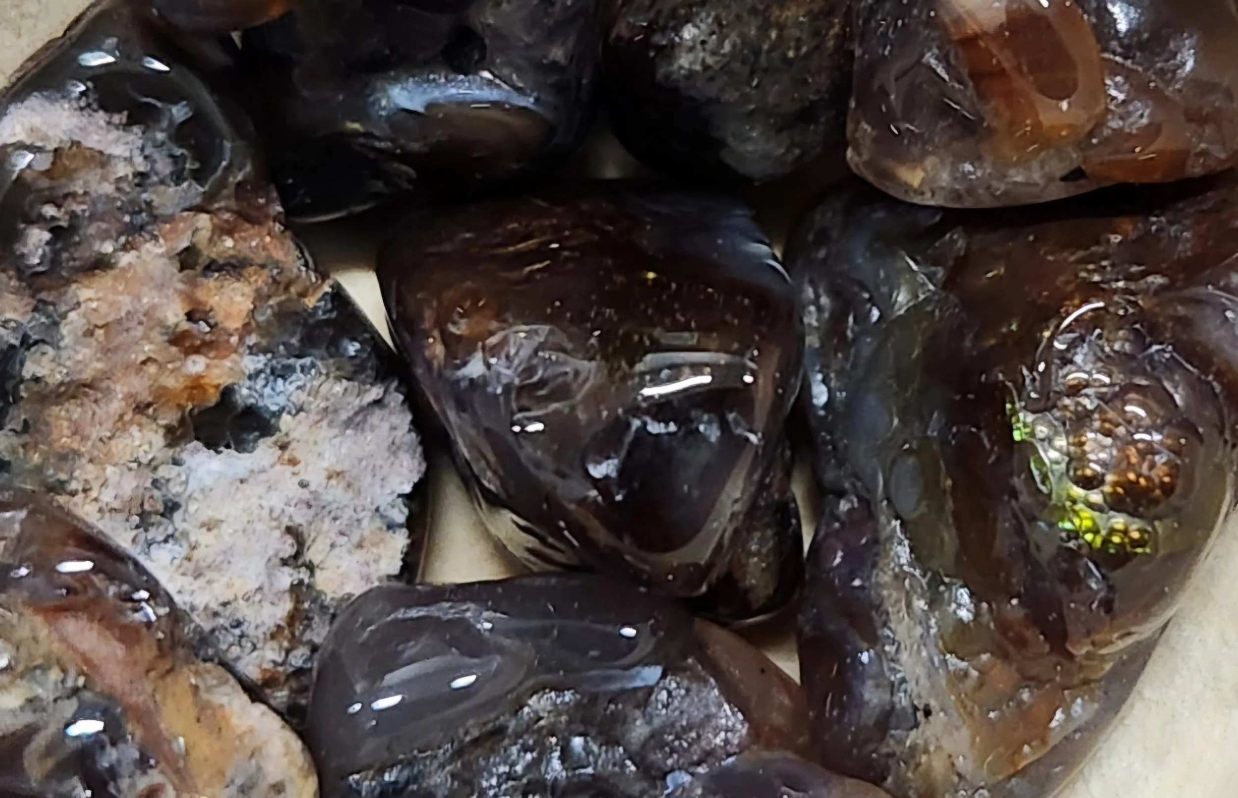 Fire Agate gemstone displaying natural iridescent fire-like patterns used for grounding, protection, and personal empowerment work