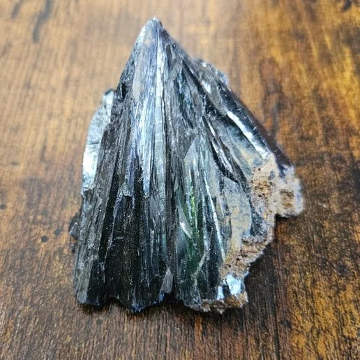 Deep blue Vivianite crystal cluster with prismatic formations on natural matrix.