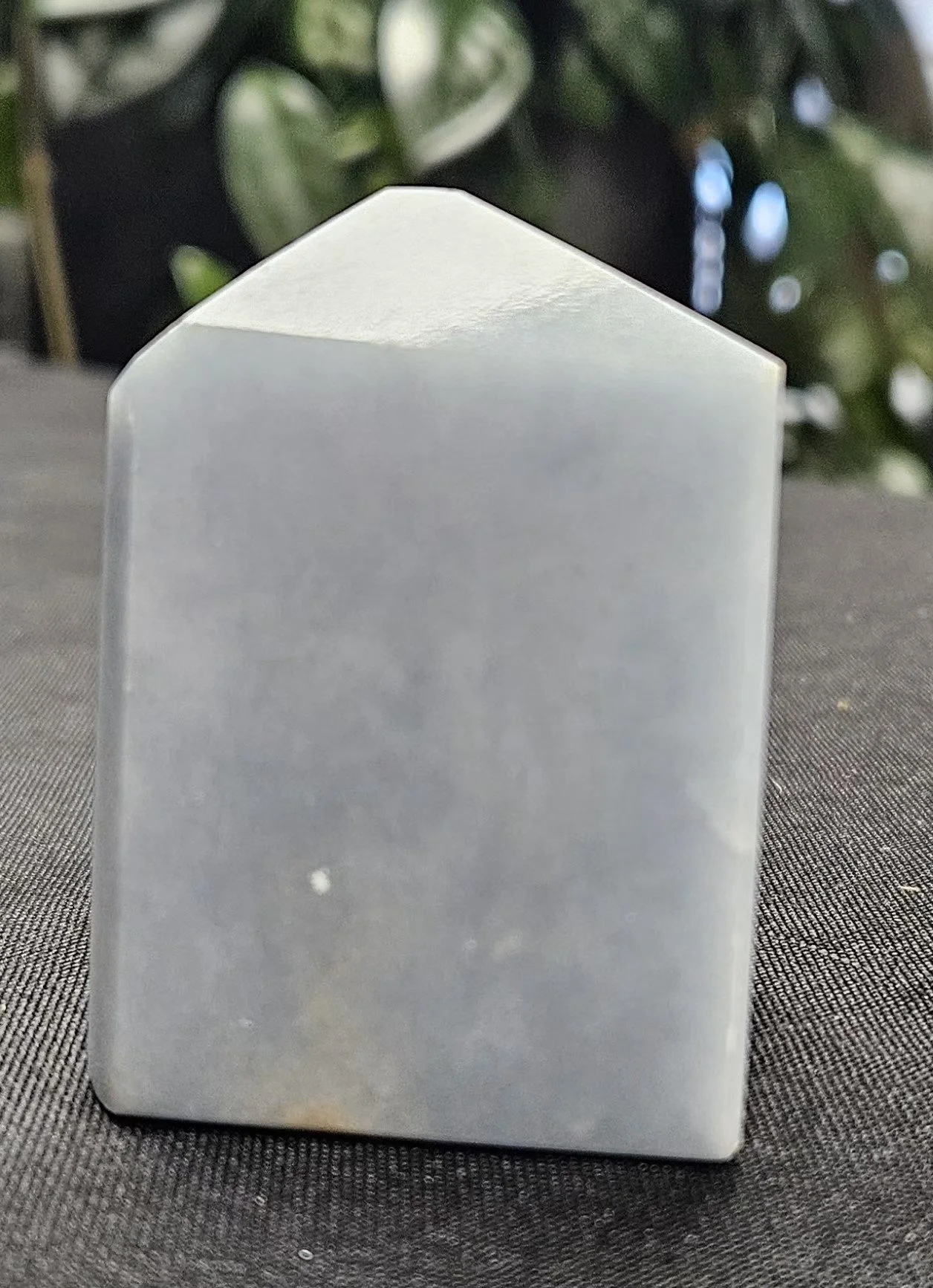 Angelite crystal in soft blue tones, showing a smooth natural texture that reflects its calming, gentle energy and serene appearance.