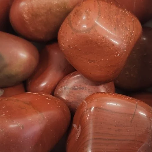 Polished red jasper stone with deep earthy red colour used for grounding and root chakra support.