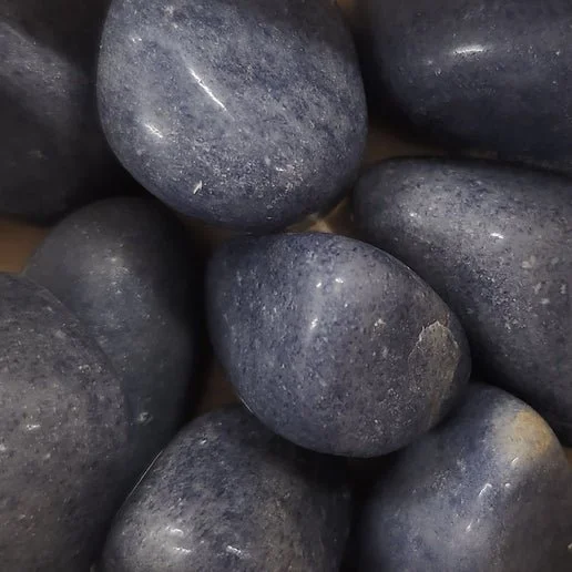 A smooth, deep blue Blue Aventurine crystal with subtle shimmering inclusions.