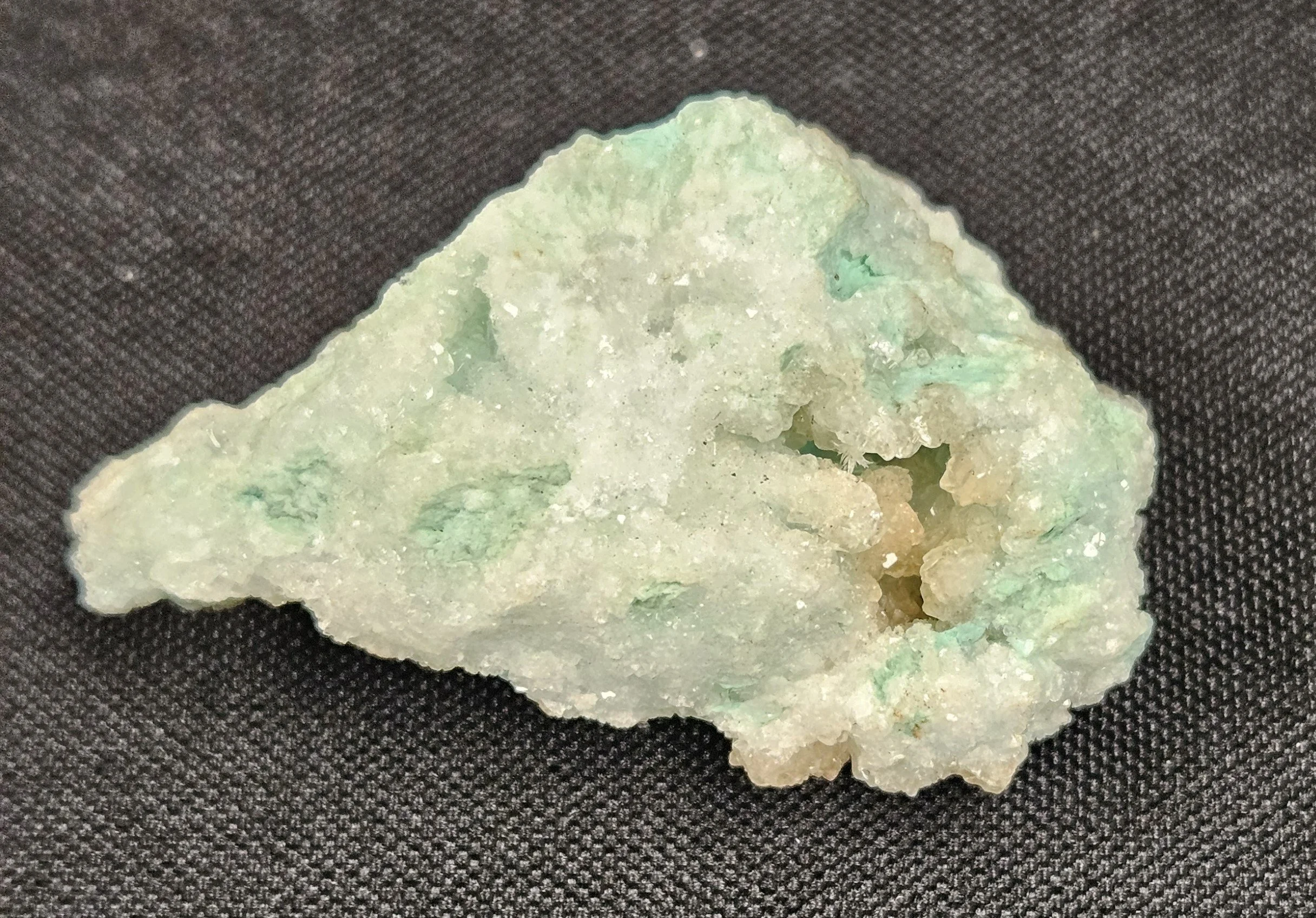 Aurichalcite crystal cluster with soft blue-green colouring and fine fibrous texture, showing a delicate, calming mineral formation.