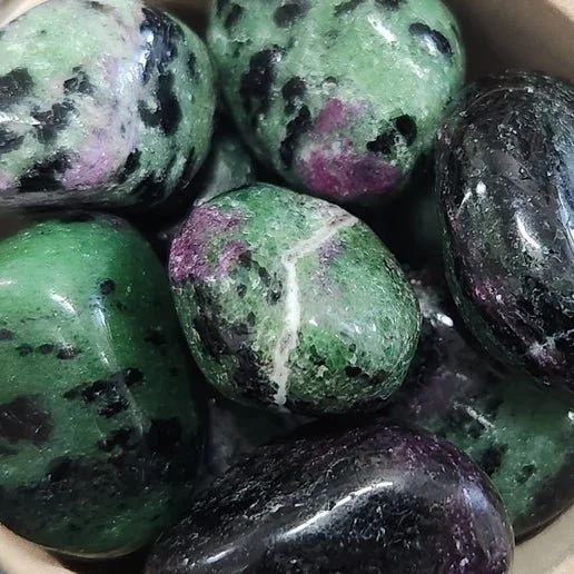 Ruby Zoisite stone showing red ruby crystals in green zoisite matrix used for heart-centred transformation and vitality.