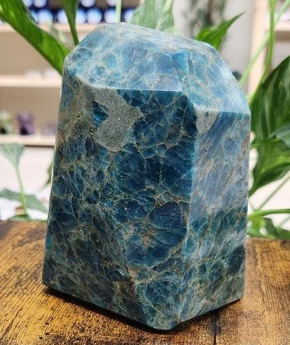 A Blue Apatite crystal with vibrant blue colouring and a smooth, lightly polished surface.