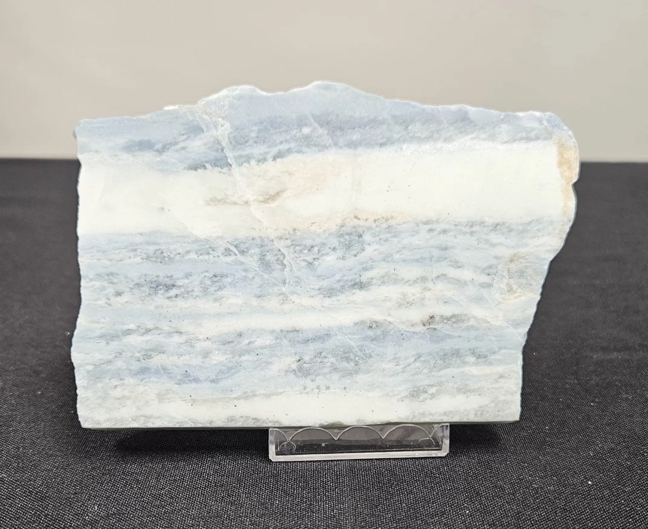 Blue Aragonite crystal with soft sky-blue tones and natural fibrous texture, showing a calming and gentle appearance.
