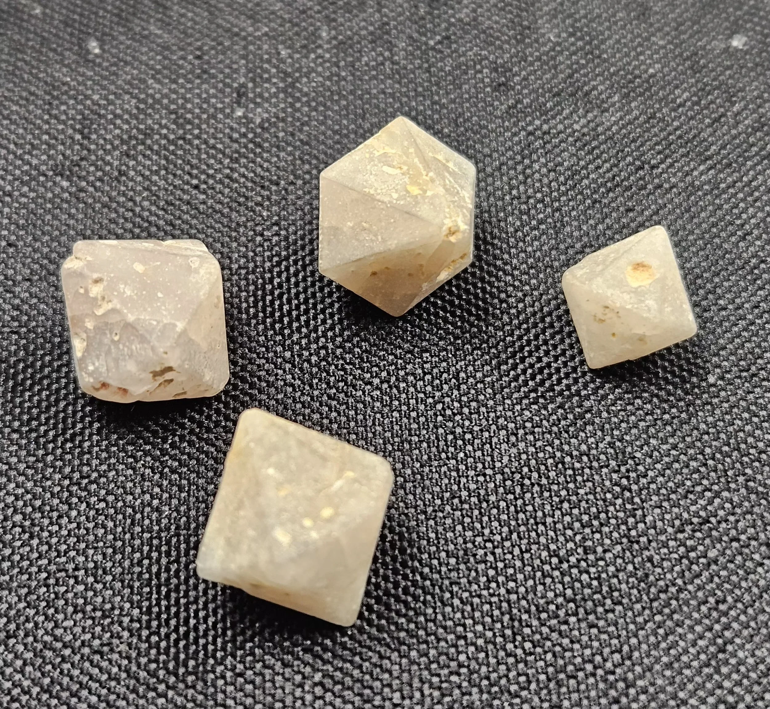 A double-terminated Beta Quartz crystal shaped as a hexagonal prism with clear, polished surfaces.