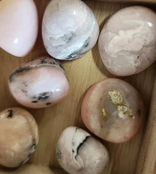 Soft blush Pink Opal stones in raw and polished forms with smooth pale rose colouring.
