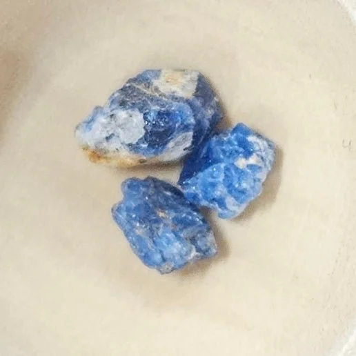 Close-up of deep royal blue Afghanite crystal with white calcite matrix, showing natural crystalline texture and rich colour variations.