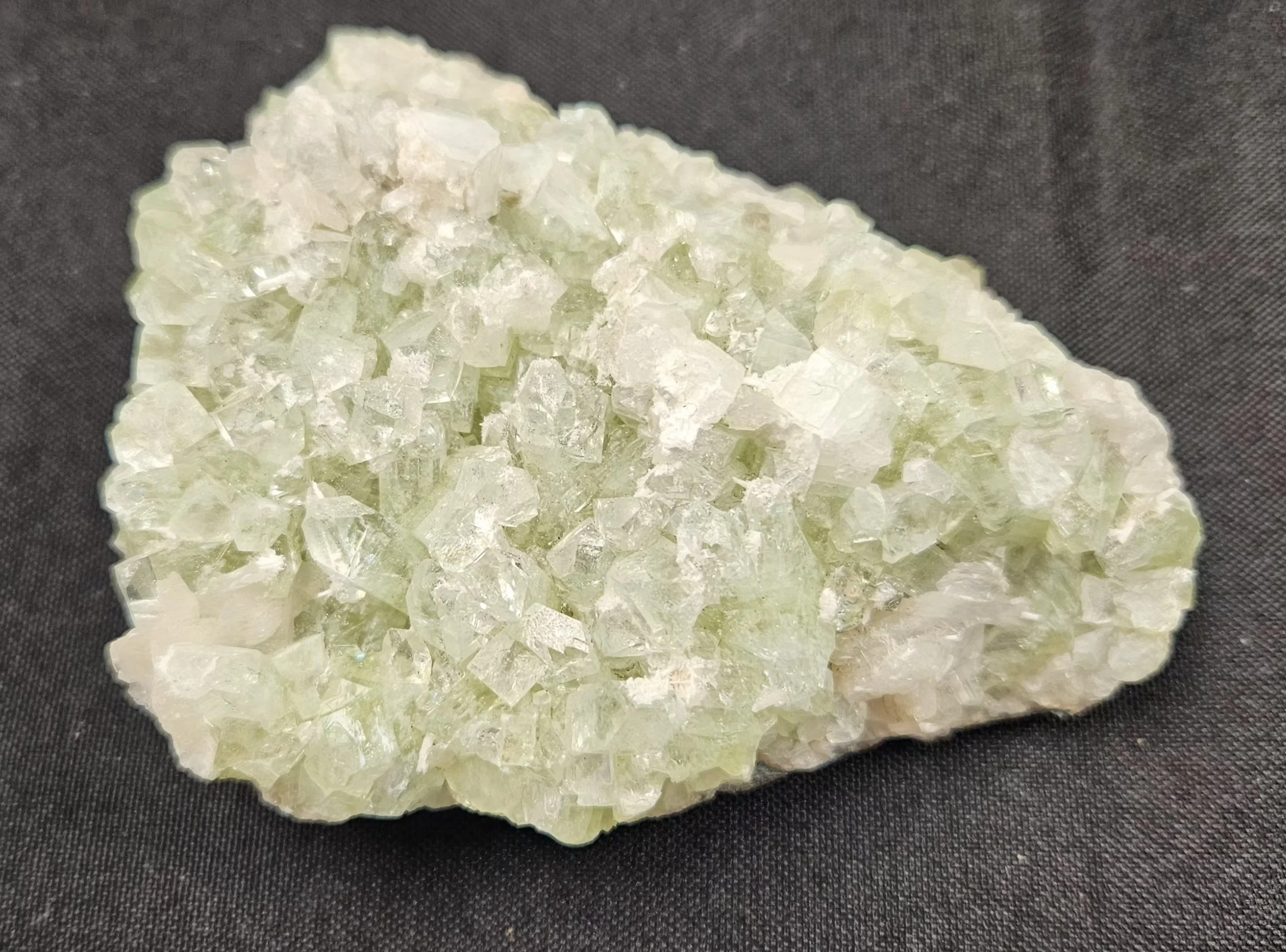 Green Apophyllite crystal cluster with soft mint-green tones and naturally formed points, highlighting its calming, heart-centred energy.