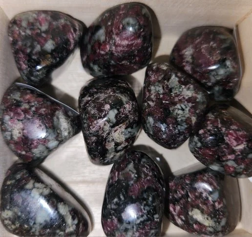 Natural eudialyte crystal specimen with deep pink and red tones in matrix, used for emotional healing and heart-centred spiritual work