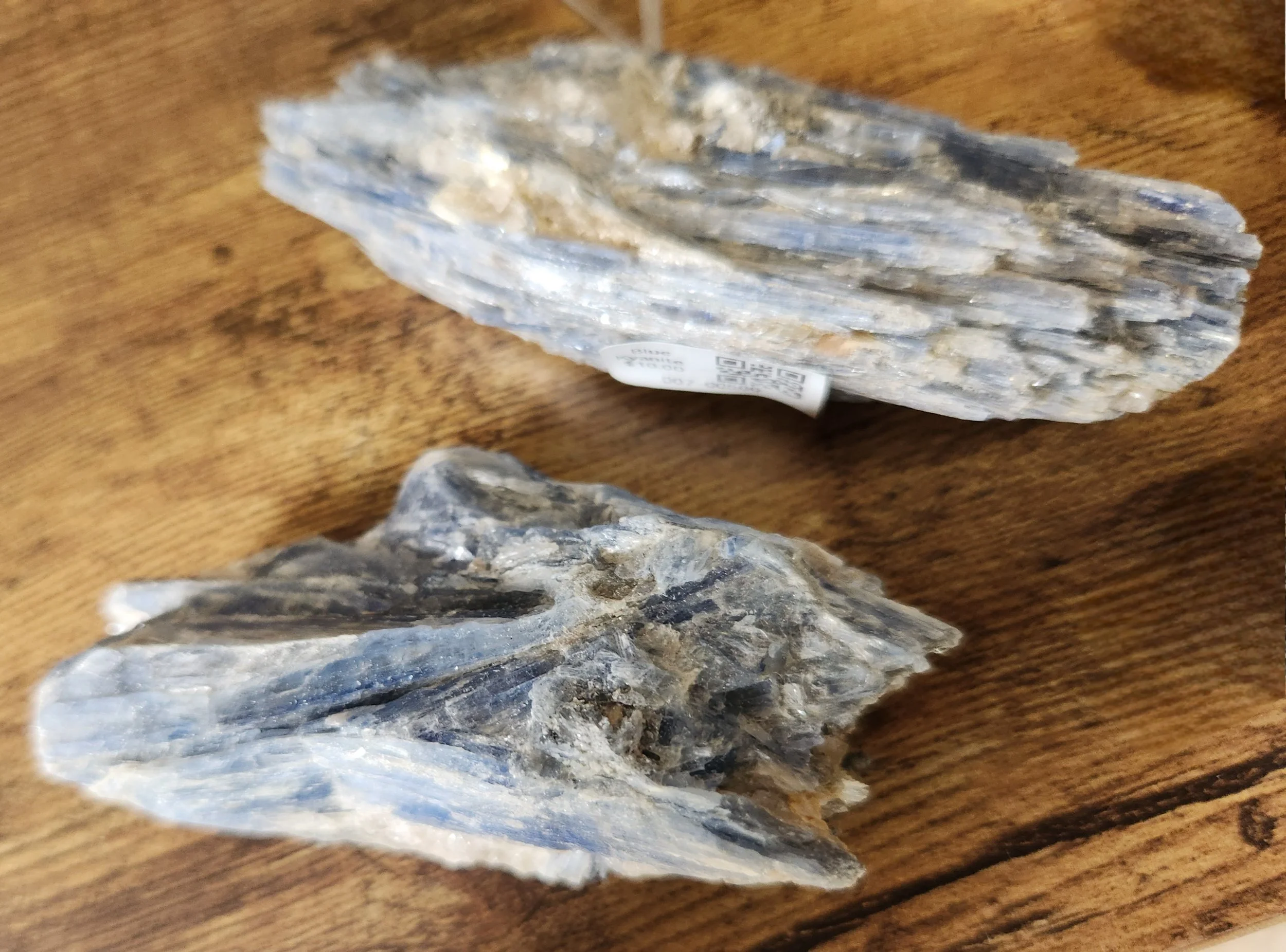 Shimmering Blue Kyanite blade crystal with natural striations shown in raw and polished forms.