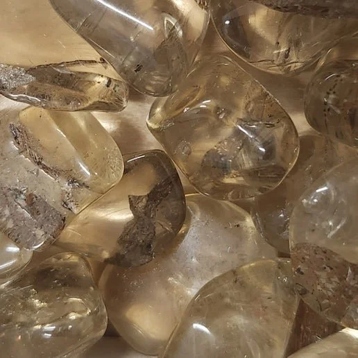 A translucent yellow Bytownite, also known as Golden Labradorite, with warm golden tones and natural internal veining, softly polished.