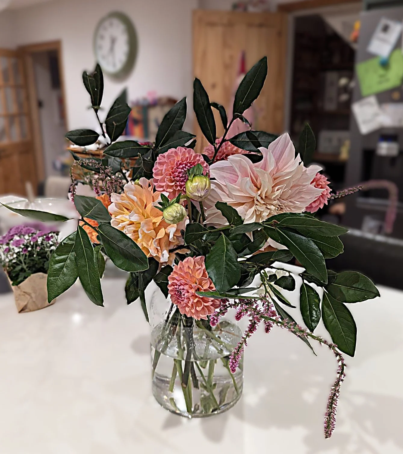 Sumptuous handtied bouquet subscription in a vase on kitchen island.JPEG