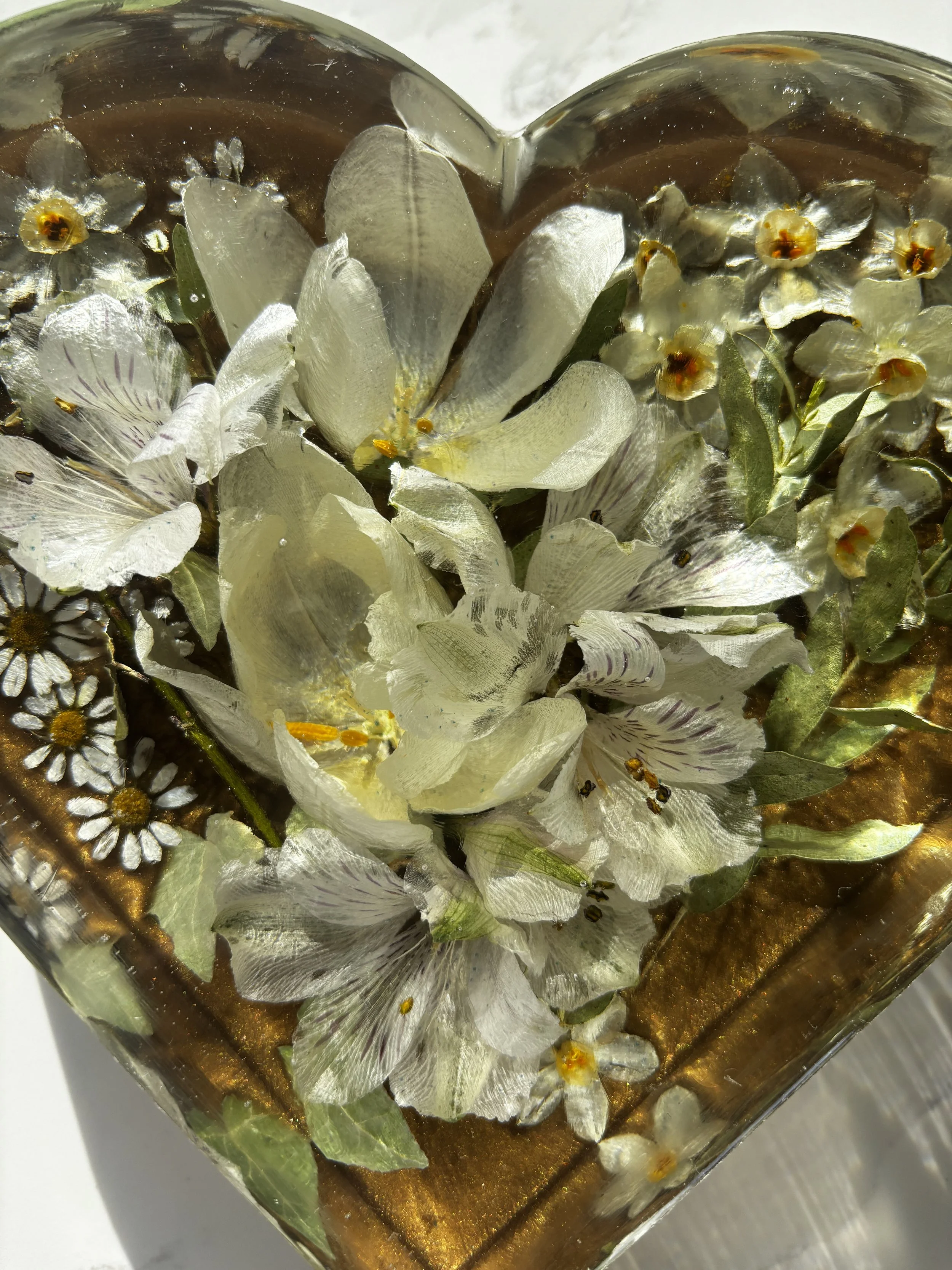Flowers set in resin heart up close.jpg
