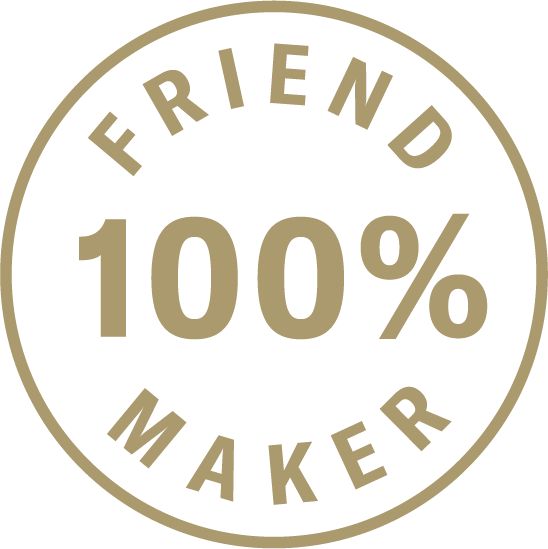 Circular badge with beige text on black background that reads "Fried 100% Maker".