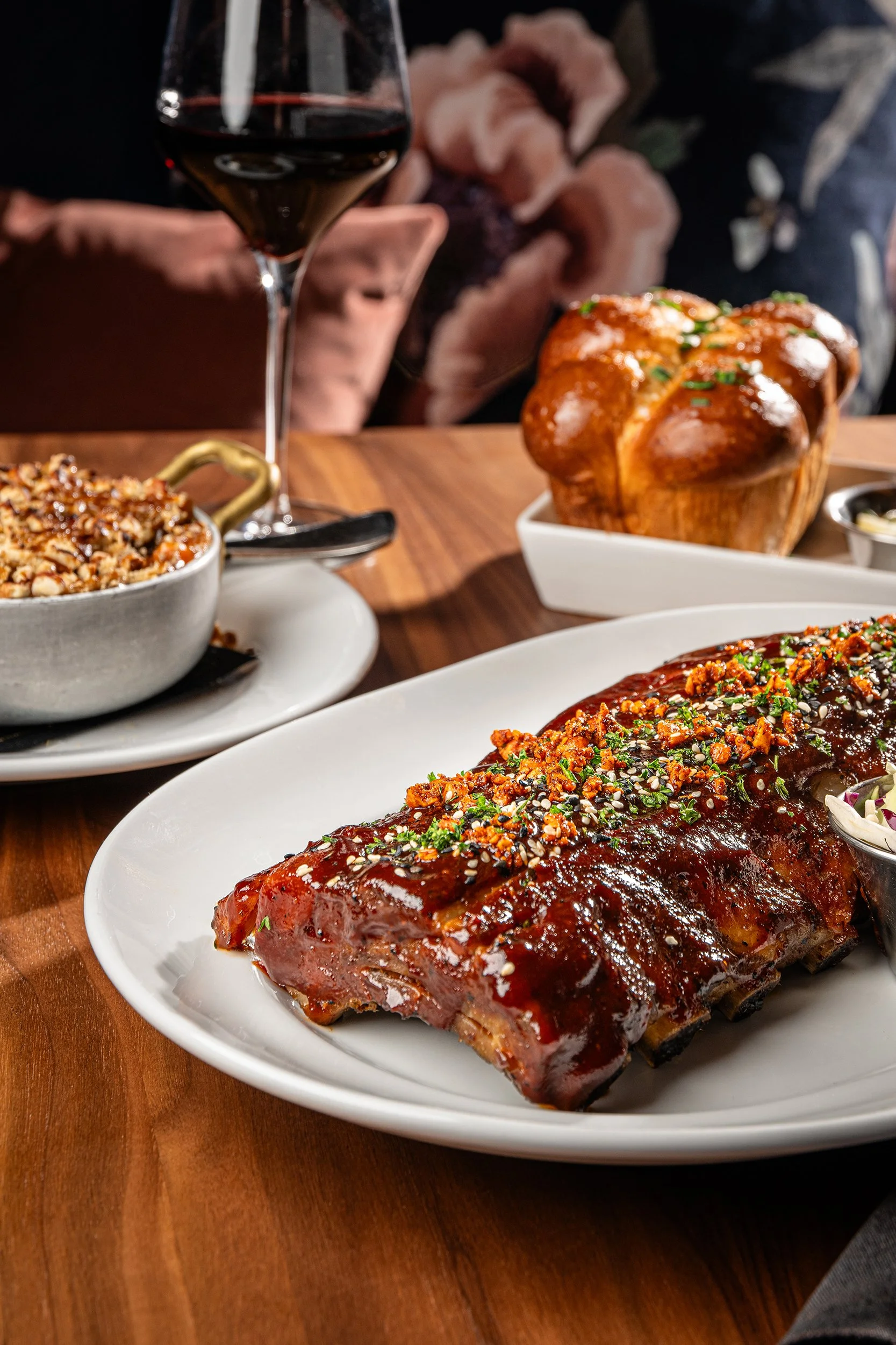 Phx Mag_Warrens Supper Club_Korean-style baby back ribs, Sweet potato souffle, bread rolls_Jill McNamara Photography_03.JPG