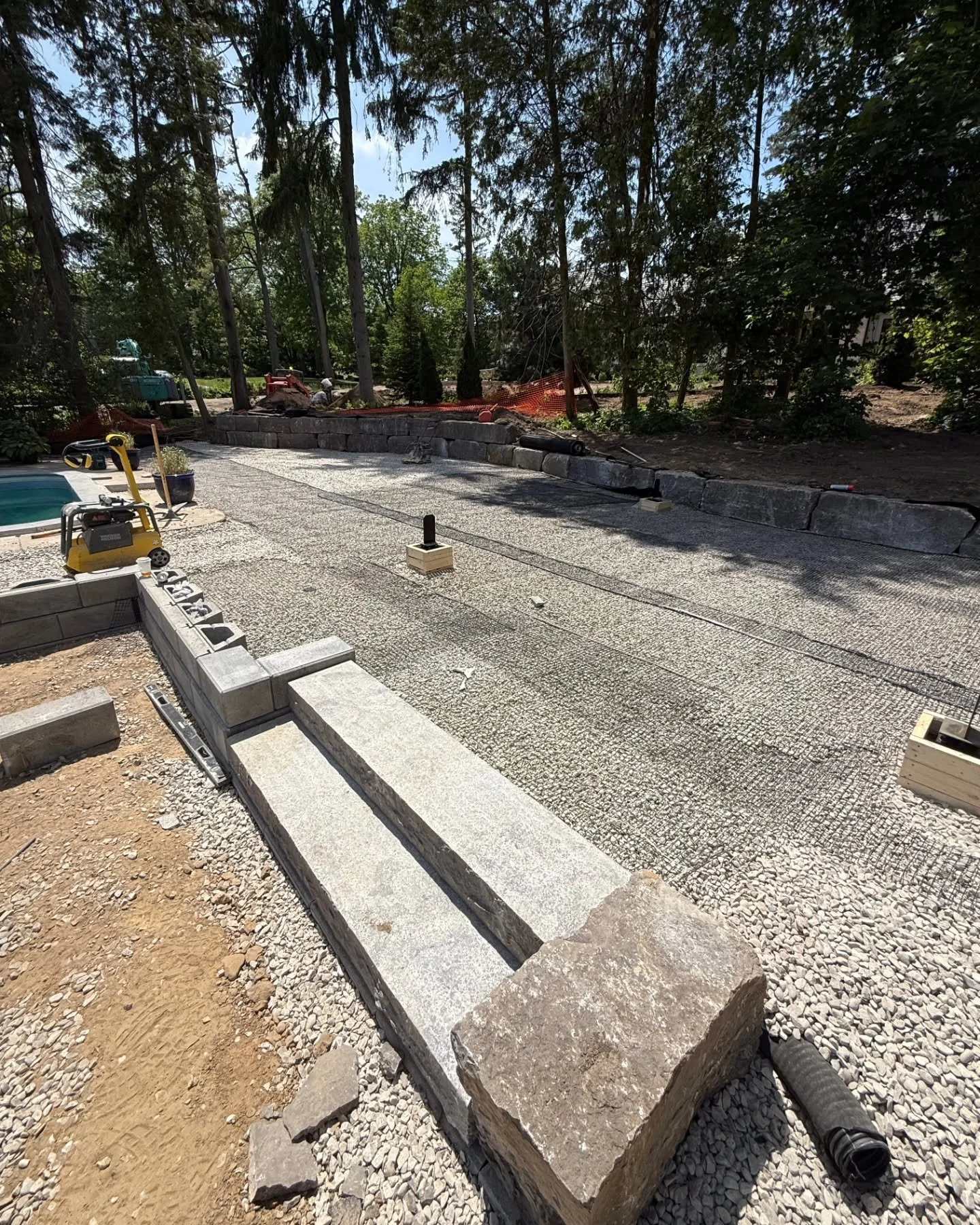 Porcelain Pimp Pad Installation - Part 2 

➡️ @techobloc - Gforce wall installed
➡️ Matching StoneArch - Silver Valley Coping installed on top of the wall
➡️ Pergola footings installed 
➡️ Completion of all base prep, geo grid and bedding layer
➡️ In