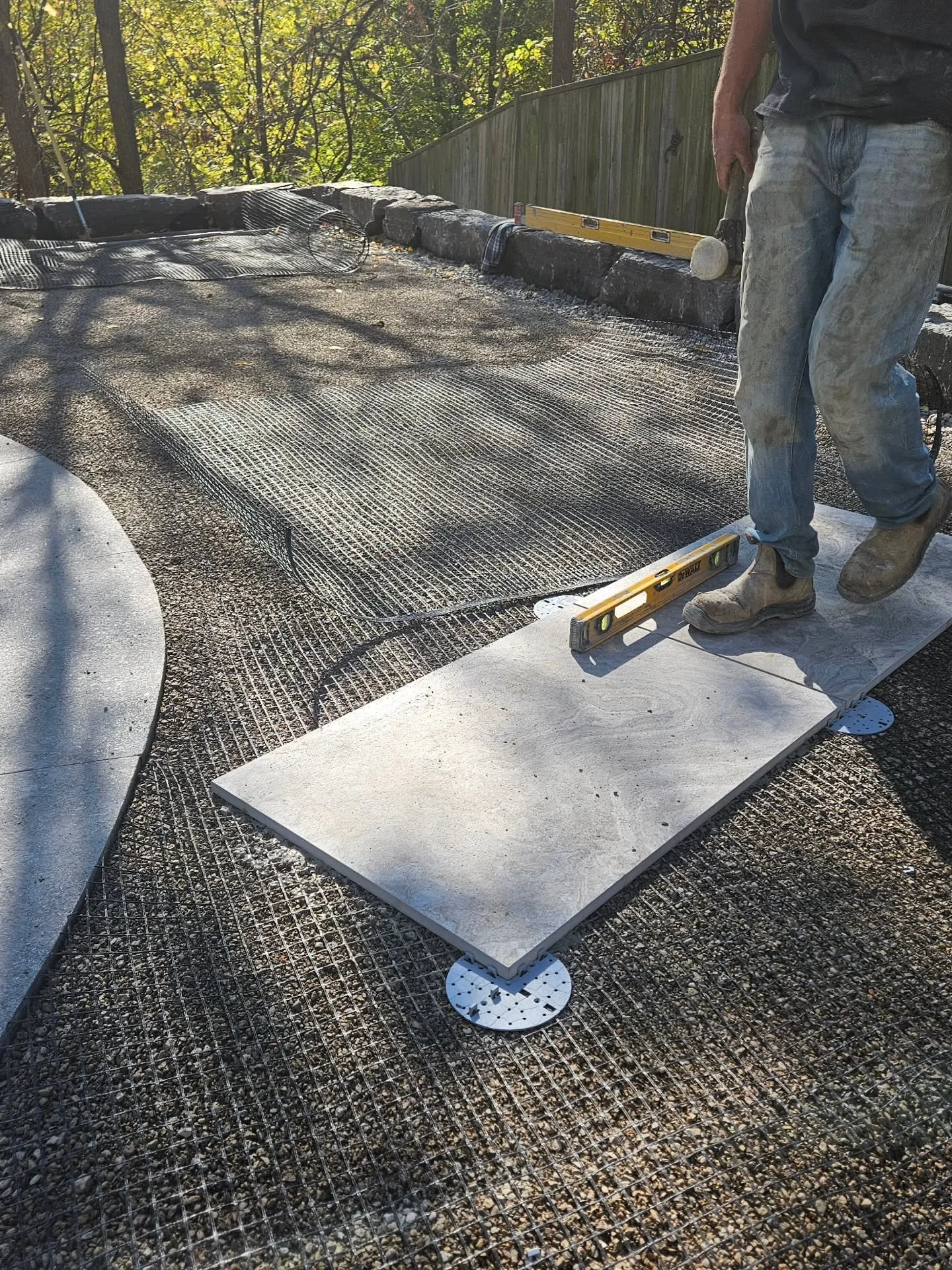 Short four-day week, but made some awesome progress with our porcelain pool deck! 

We back buttered each 2'x3' piece totaling over 100 so far. Leveled each single one, and made sure all our crazy slopes away from the pool, house, and towards our ste