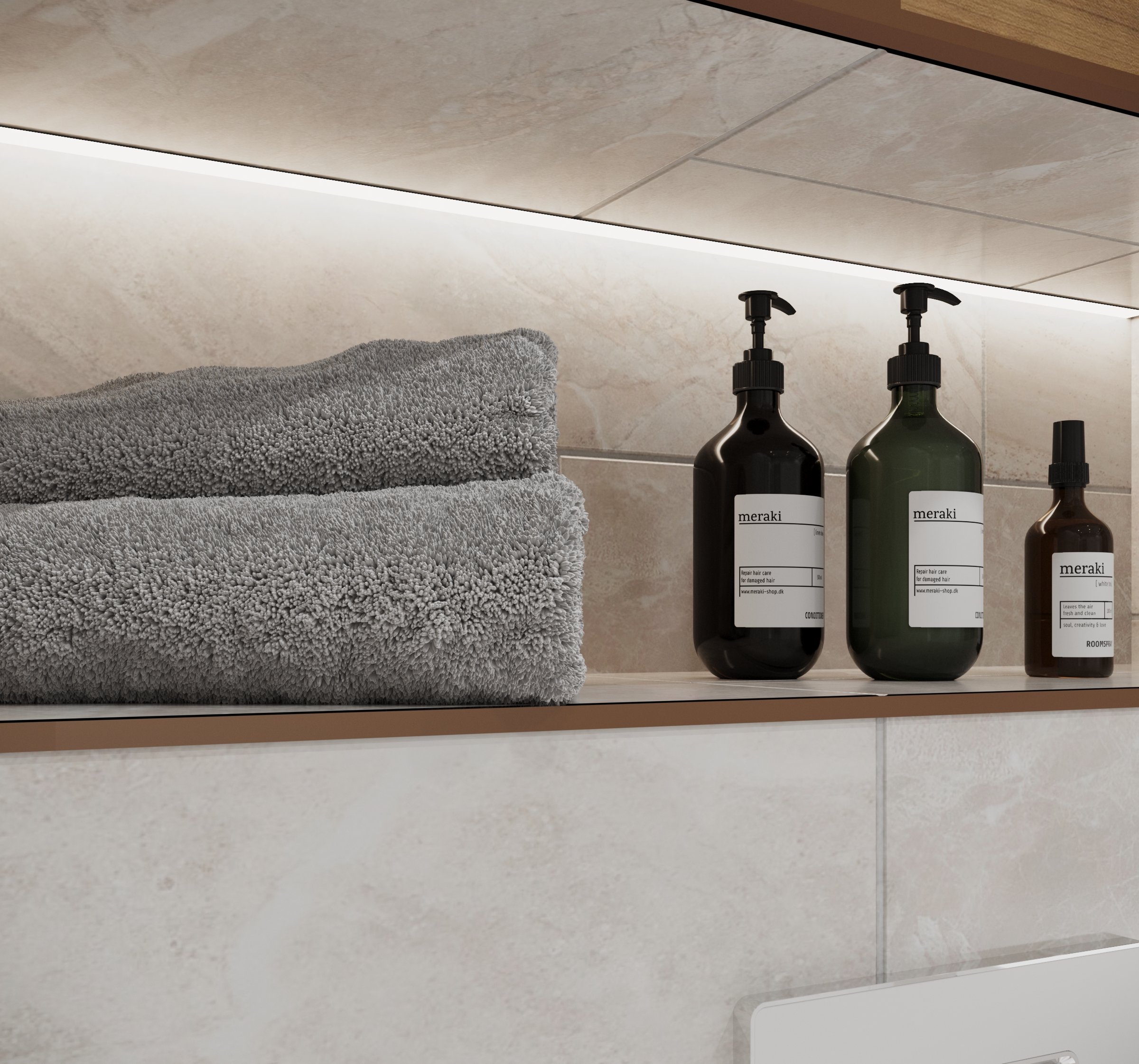 Two folded gray towels, and three bottles of meraki hair care and room spray products on a bathroom shelf.