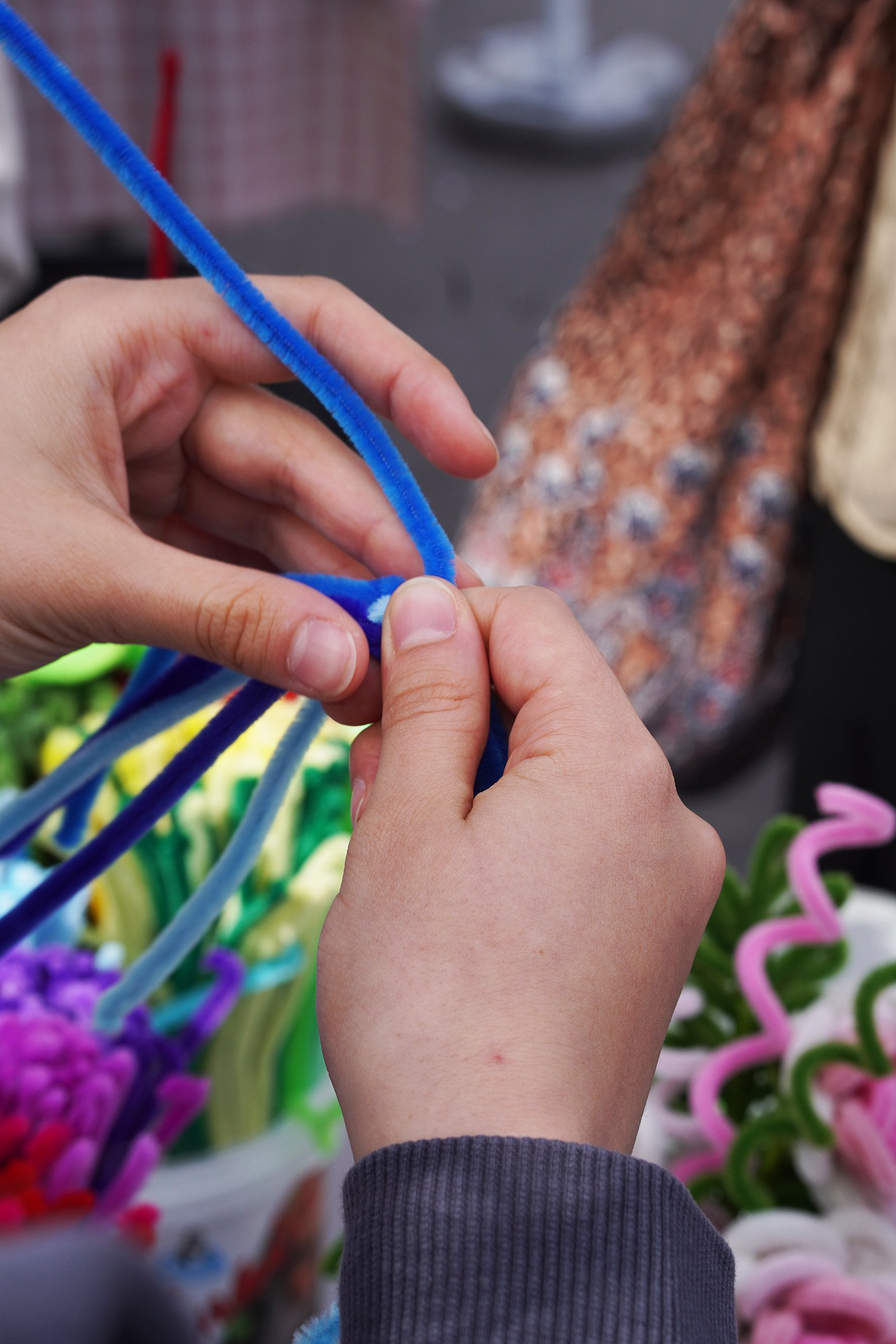 A close-up capturing the process behind the handmade flower workshop.