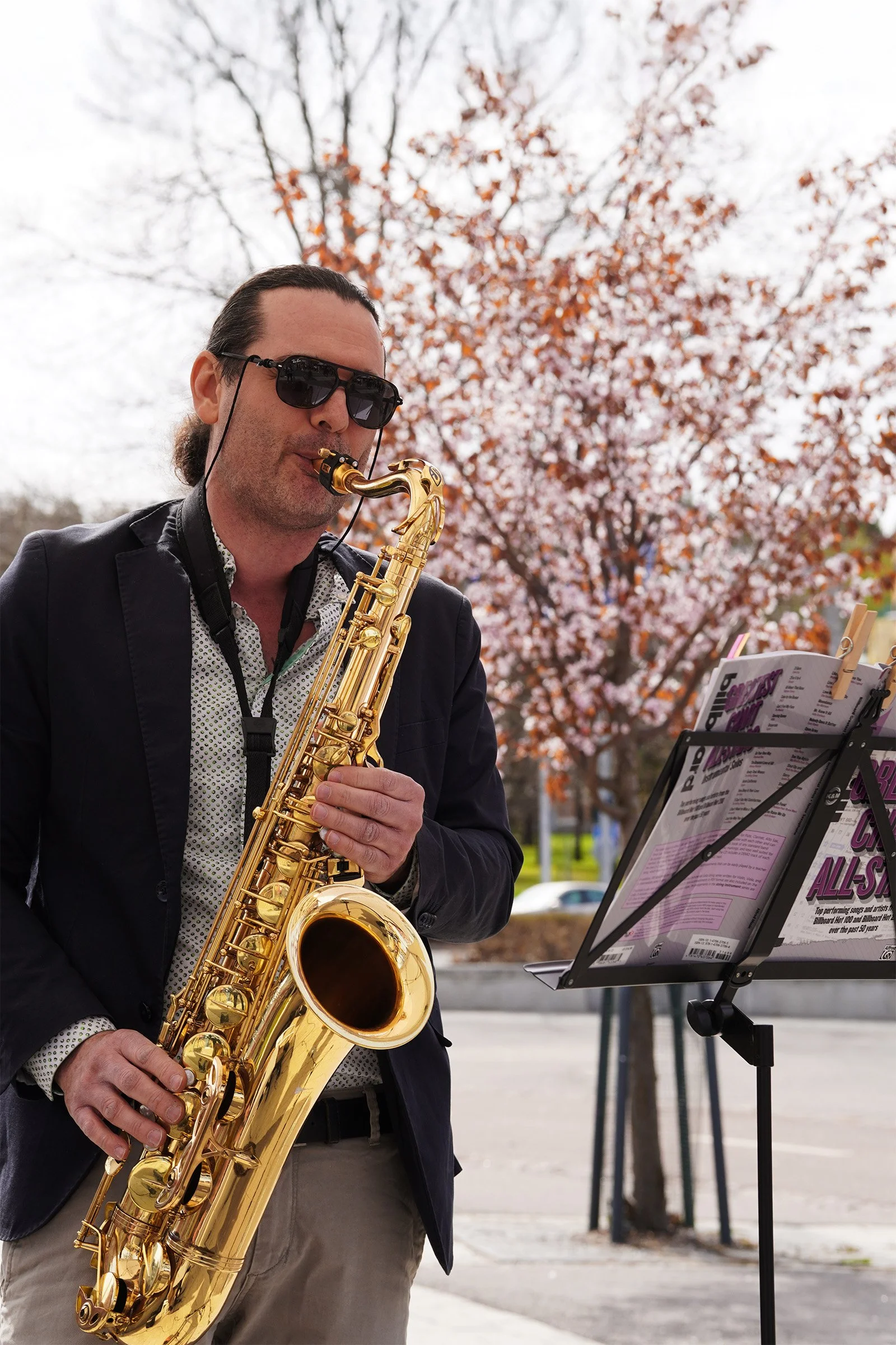 A saxophone performance adding atmosphere to the event throughout the afternoon.