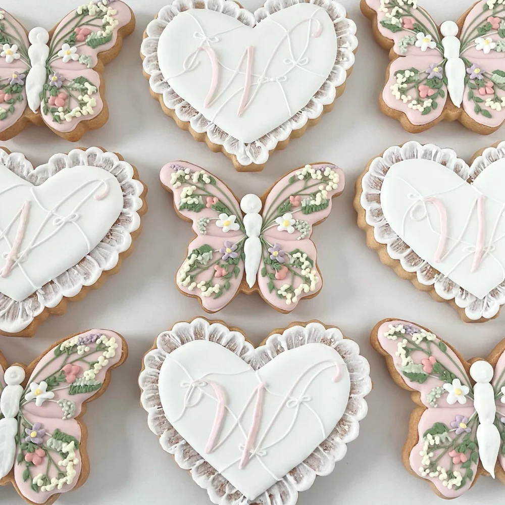 Butterfly and heart sugar cookies with monogram icing