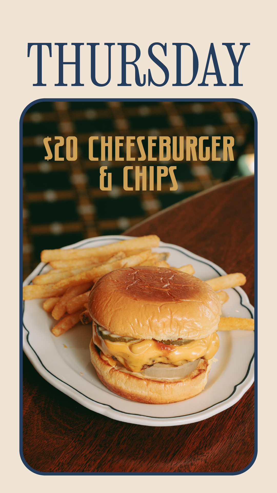 A cheeseburger with pickles and melted cheese served with French fries on a white plate, on a wooden table.