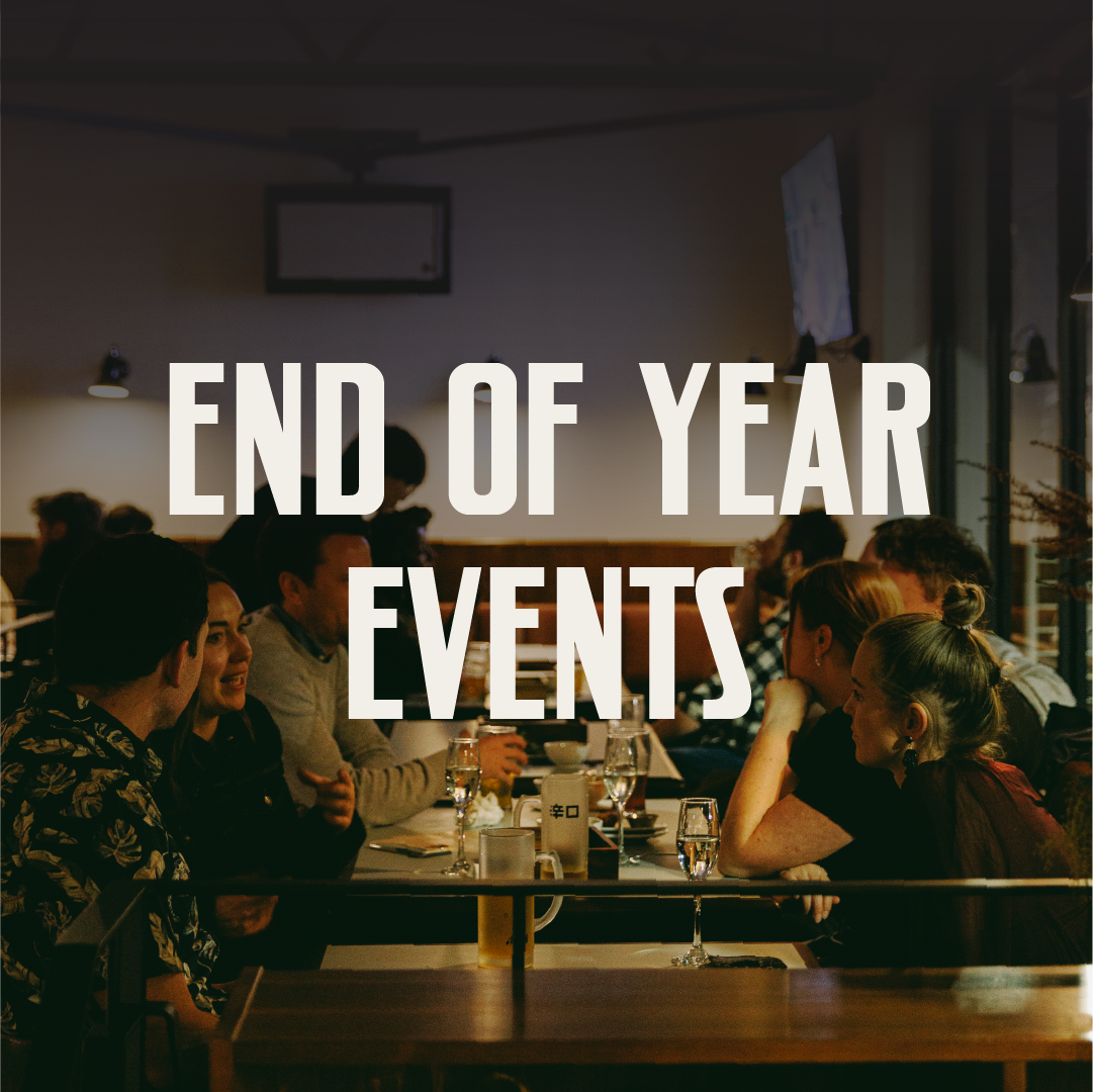 Group of people having dinner in a restaurant during an end of year event.
