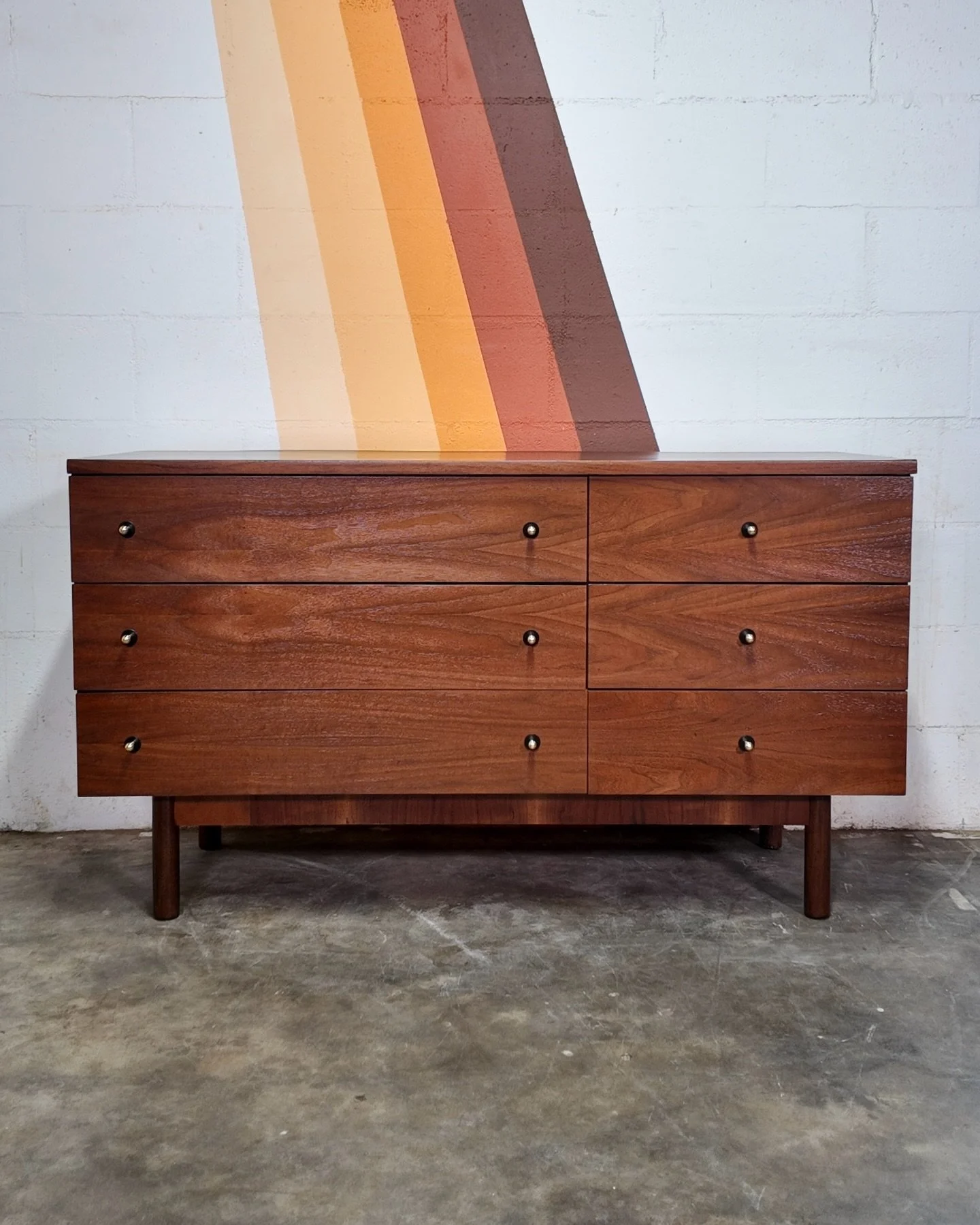 Stanley Walnut Dresser with Laminate Top [$695]
.
Dimensions: 52&rdquo;W x 30&rdquo;H x 19&rdquo;D