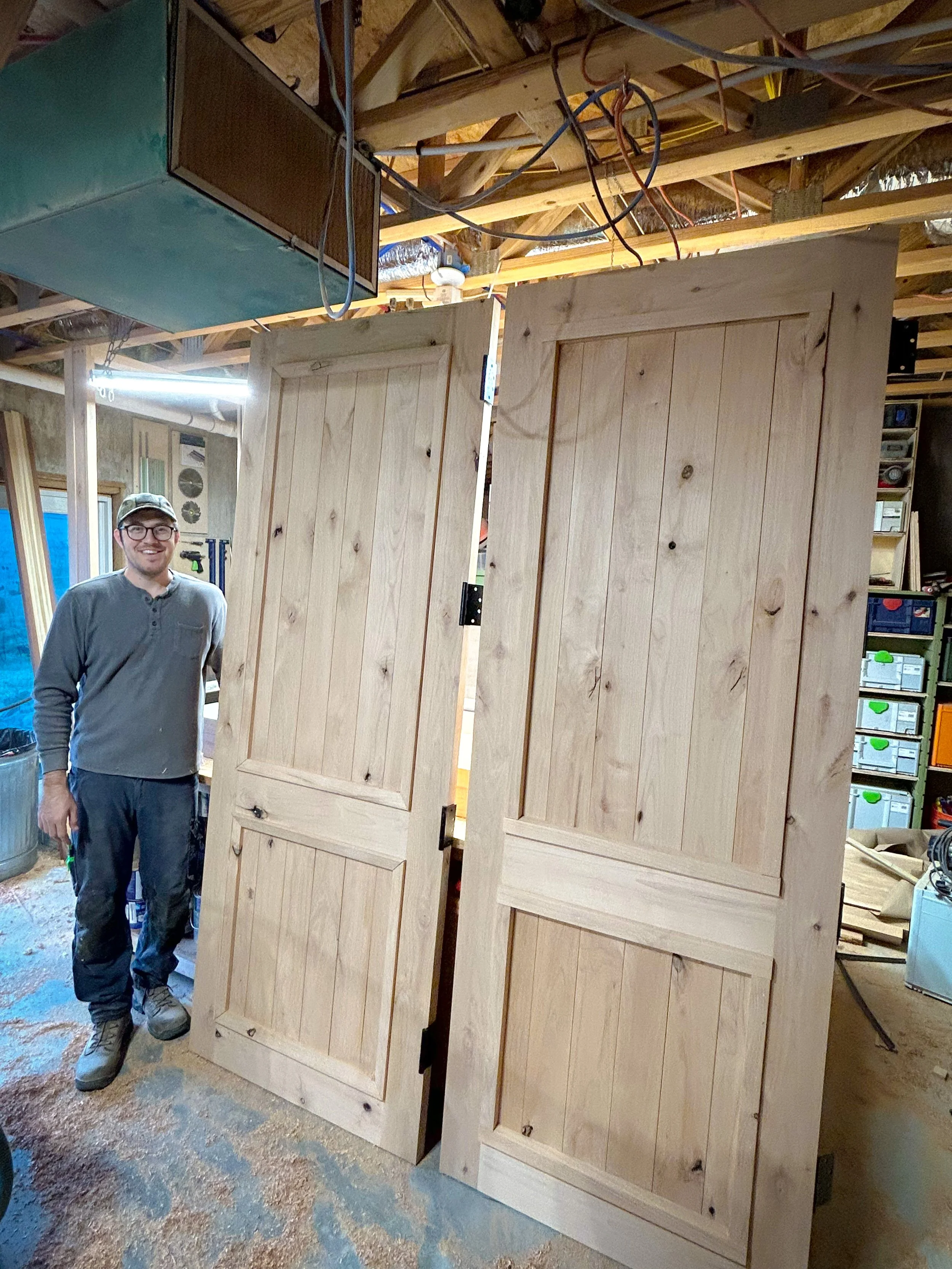 Two Knotty Alder exterior cottage doors. These are well designed to shed water and last a long time in the custom home they are now installed in!