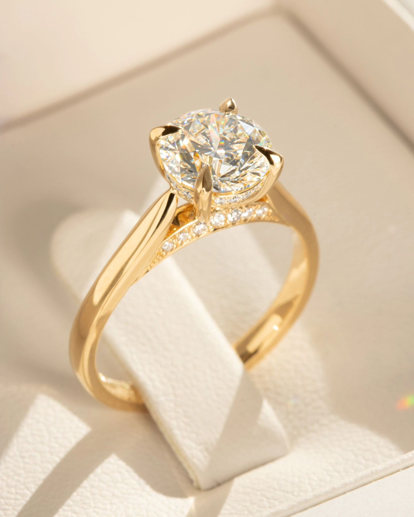When the sun pops out just in time to get a super sparkly shot of this gorgeous Diamond and 18ct Yellow Gold engagement ring. With collet and bridge diamond details, this piece is designed to sparkle and created to last the test of time x