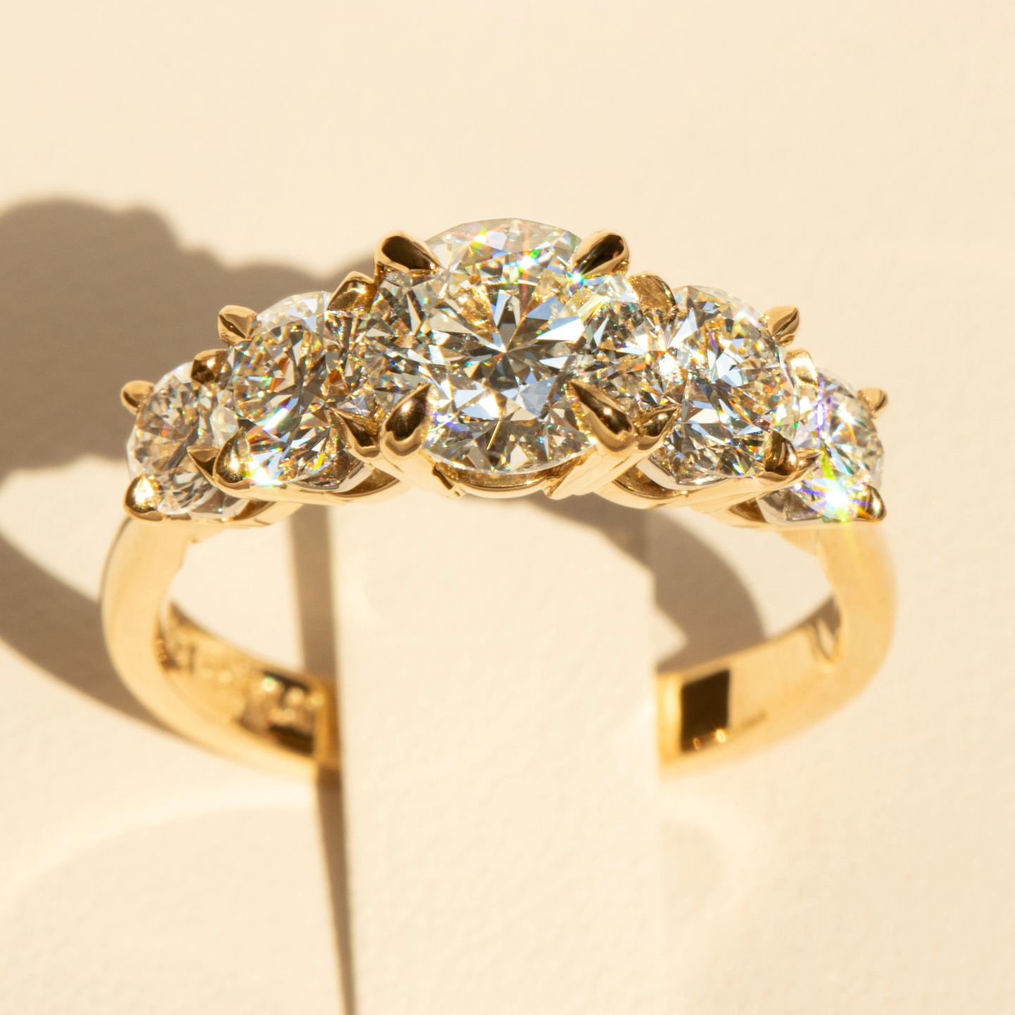 The ultimate showstopper ~ containing FIVE exquisite Round Brilliant Cut Diamonds, captured in 18ct Yellow Gold with customised Platinum details. It's always a pleasure to design and create such a spectacular engagement ring for our customers.