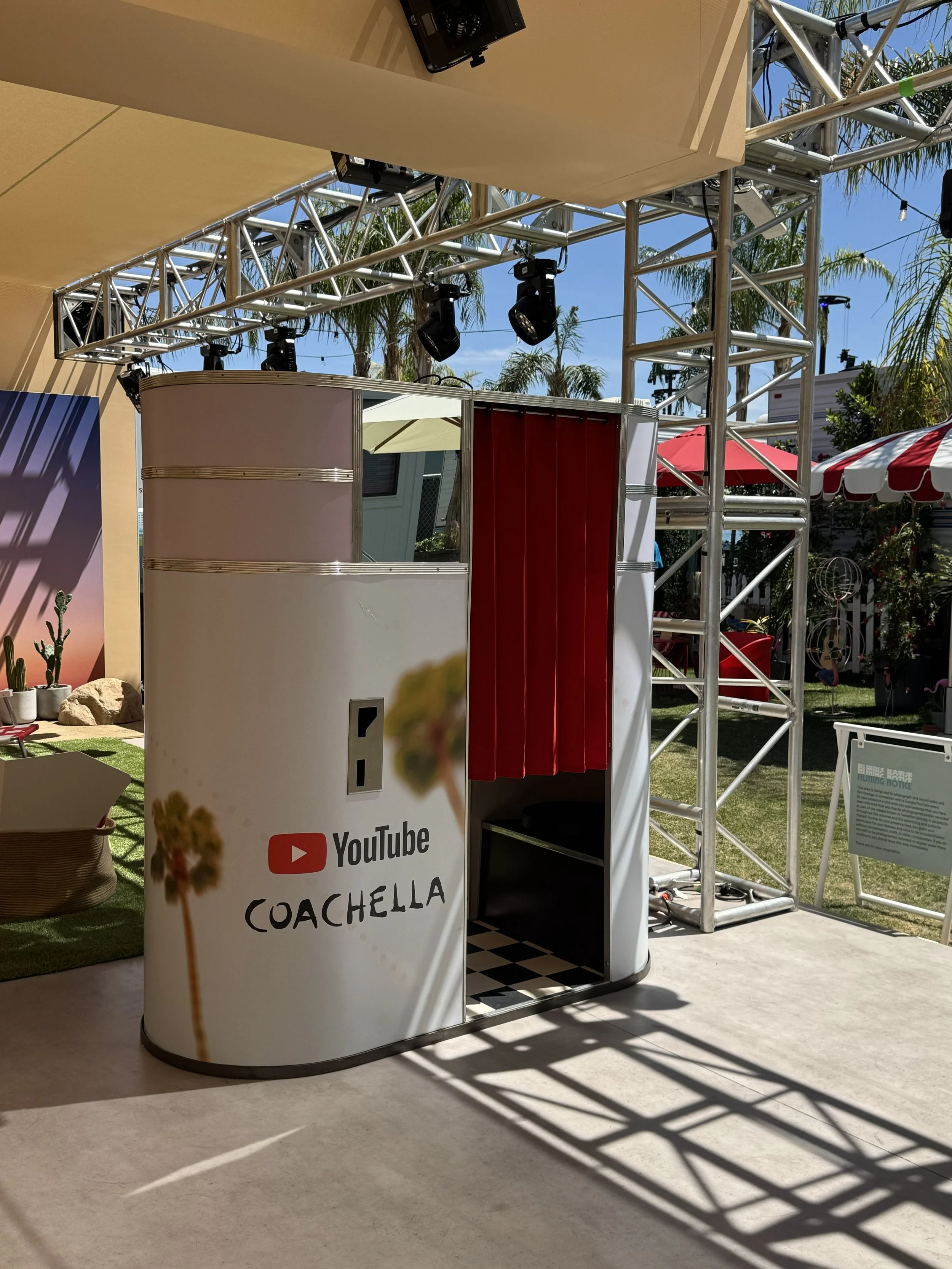 A Model 11 vintage analog photobooth at Coachella with a YouTube Coachella decal.
