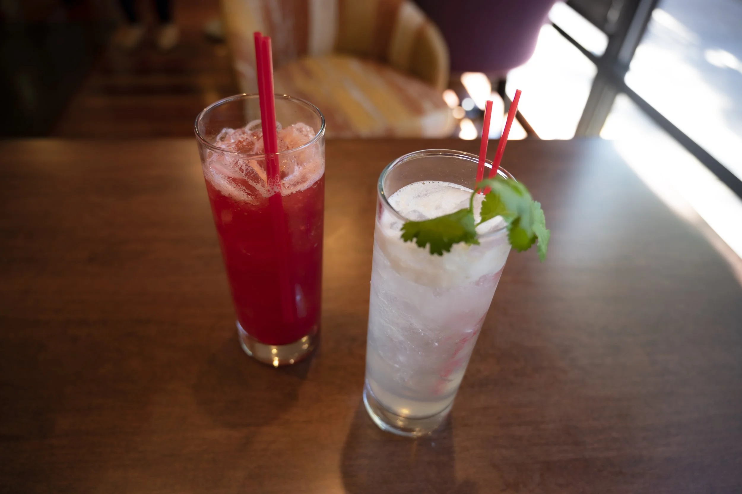 2 glasses of cocktails dressed in mint