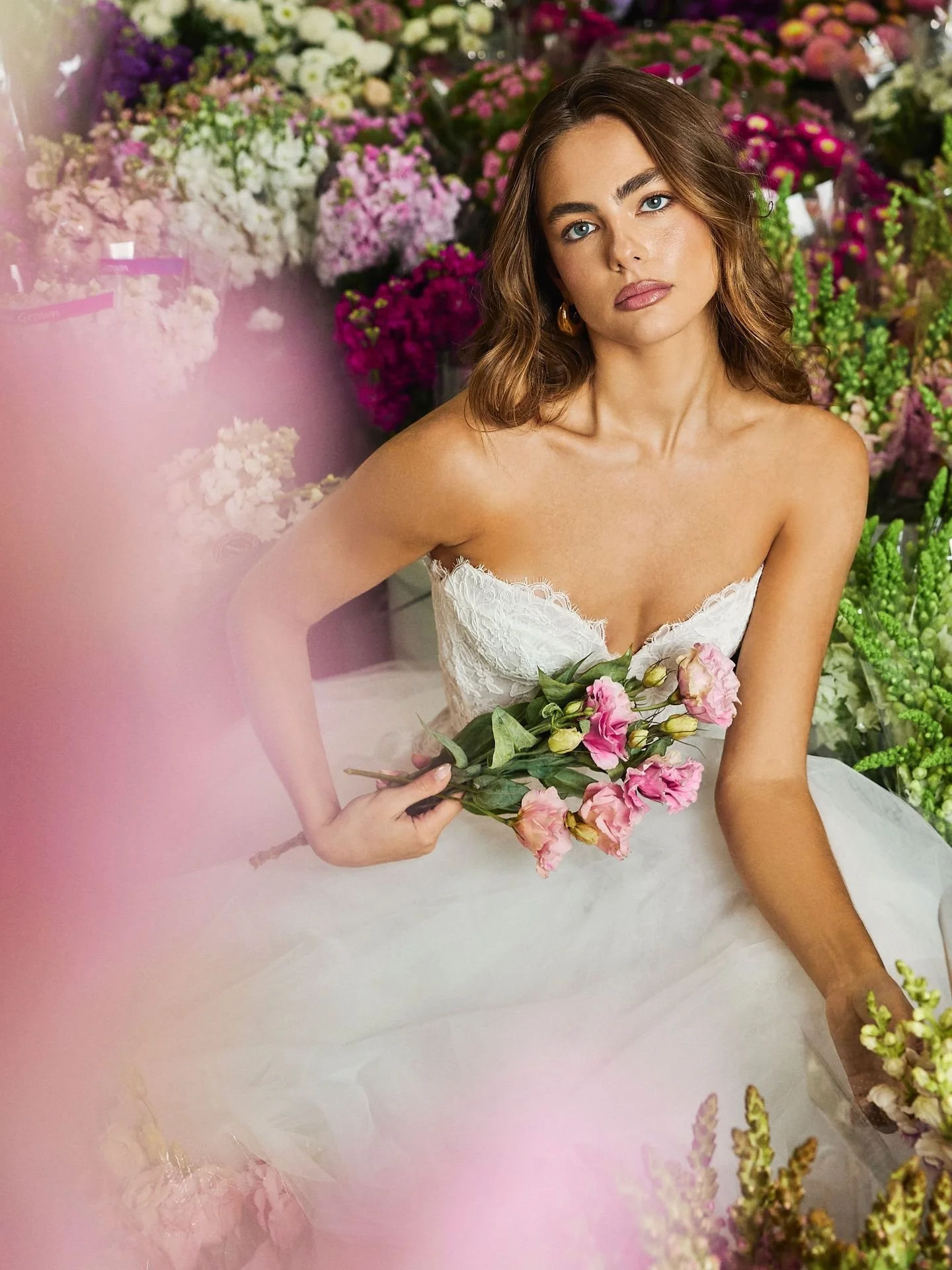 Blossom Code by @alenaleenabridal shot at the Sydney Flower Markets.

Rows of flowers, bold colours and natural texture became part of the story, adding depth and energy without taking away from the gowns. Every frame was designed to feel editorial w