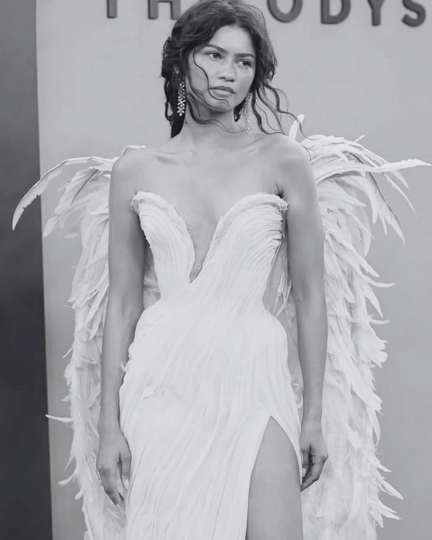 Zendaya isn't dressing "bridal" on purpose. The looks just keep giving bridal anyway.

At The Odyssey premiere in Paris, she wore a bridal-white Louis Vuitton gown, two-tone lace, a dramatic cut-out torso, a high-leg slit, and a ruffled bol