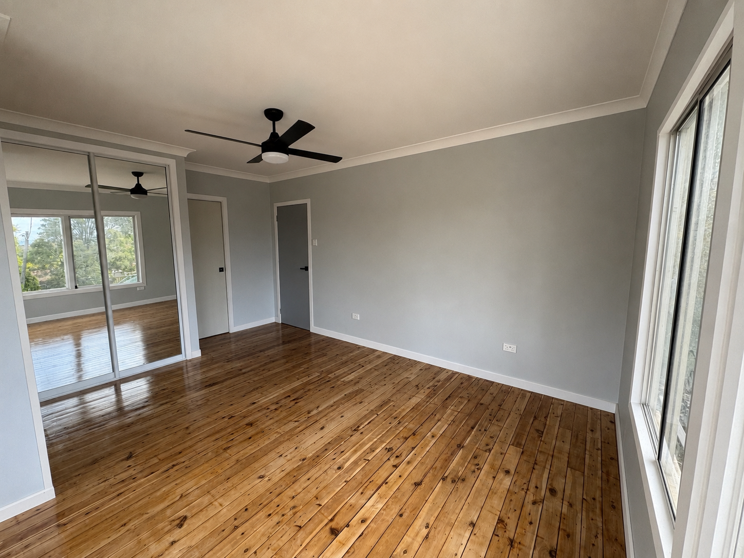 bedroom renovation timber floors and mirror wardrobe