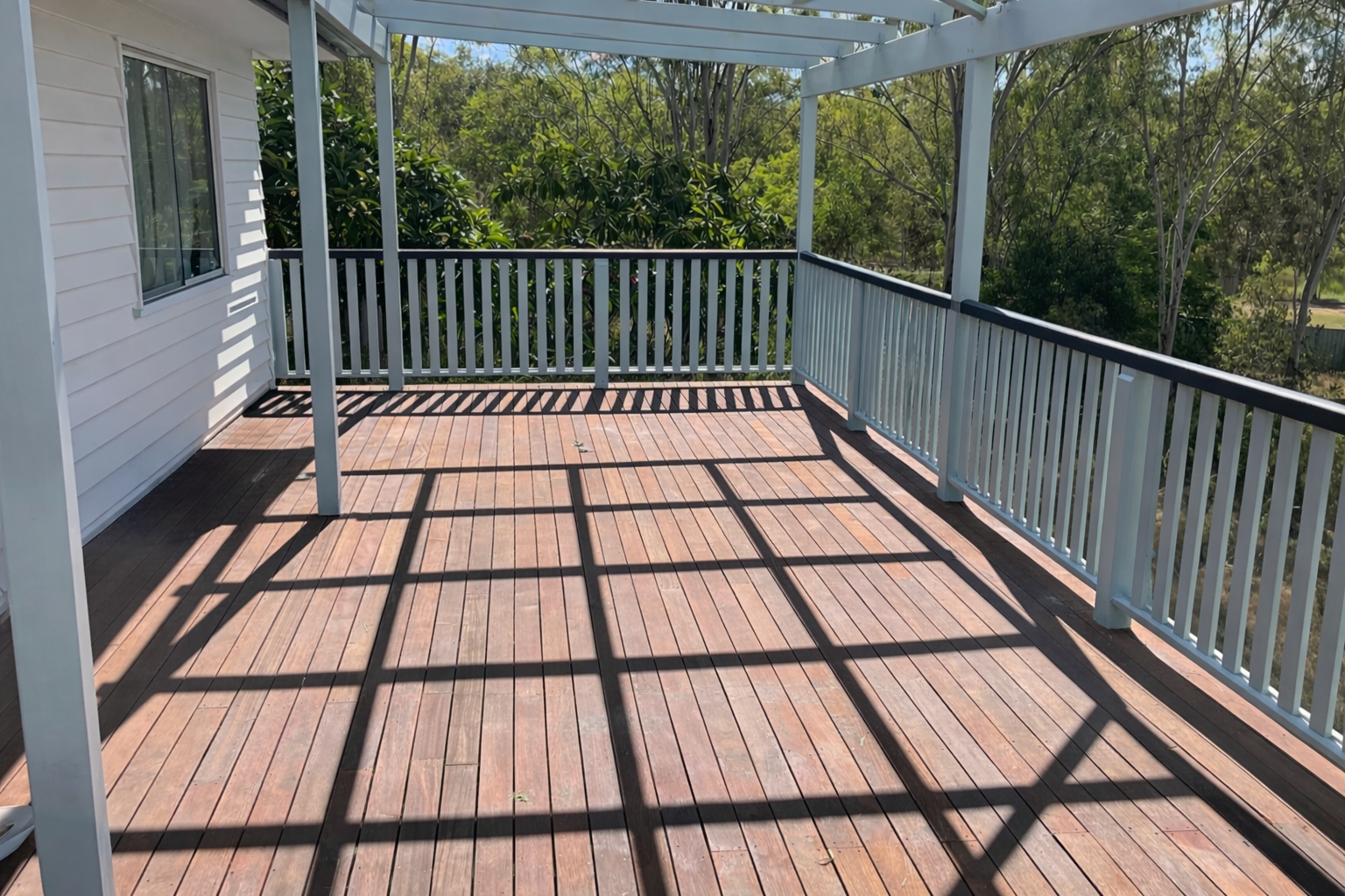 Timber outdoor deck with pergola and railing