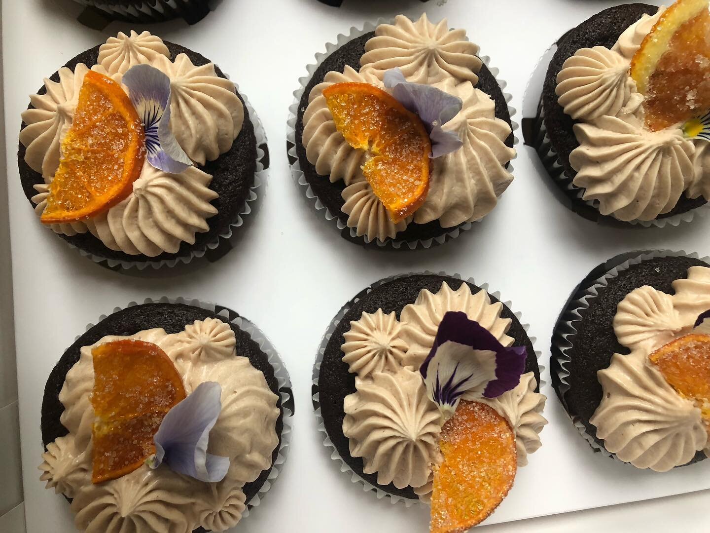 Gluten free &amp; dairy free Chocolate Cupcake with vegan coffee cream frosting.

Topped with a pansy and candied orange slice 🍊

#glutenfree #dairyfree #veganbuttercream #coffeefreak #chocolate