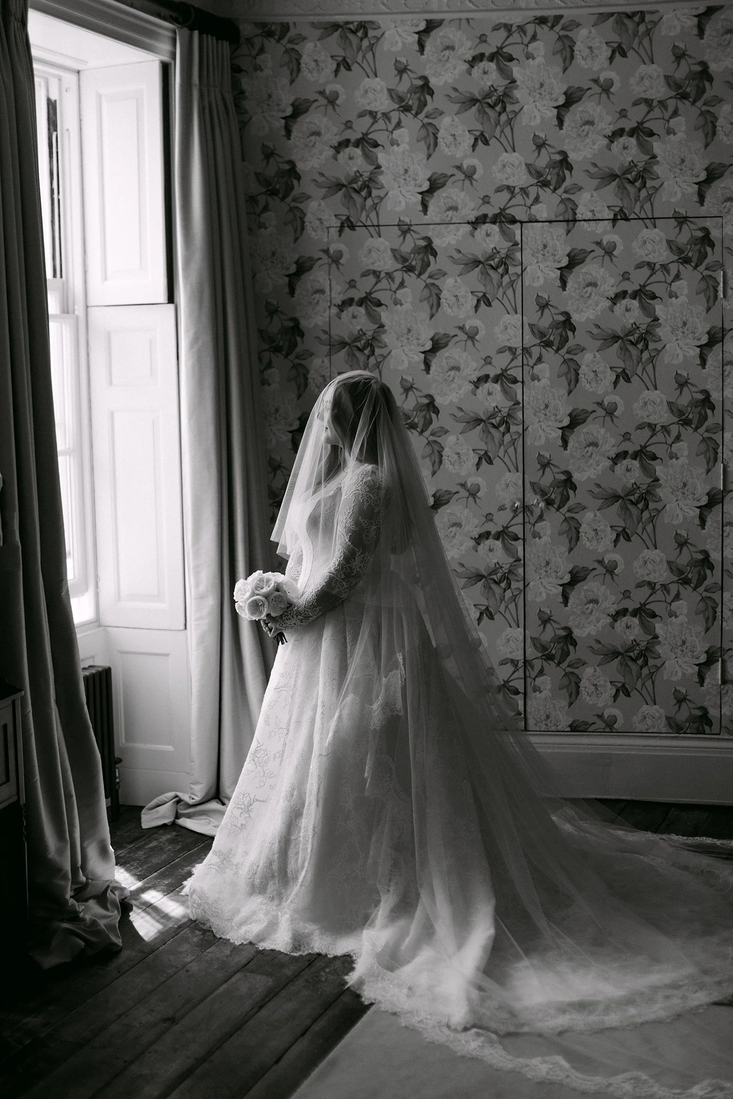 bride wearing lace Suzanne neville dress at Kent wedding