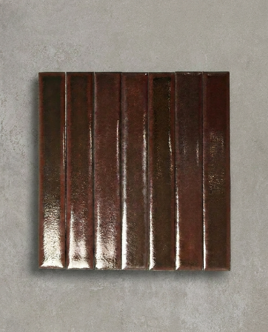 TSUKI Bloodstone is a handcrafted Japanese ceramic wall tile with a slim profile and richly variegated glaze, bringing depth, warmth, and refined elegance to contemporary interiors.