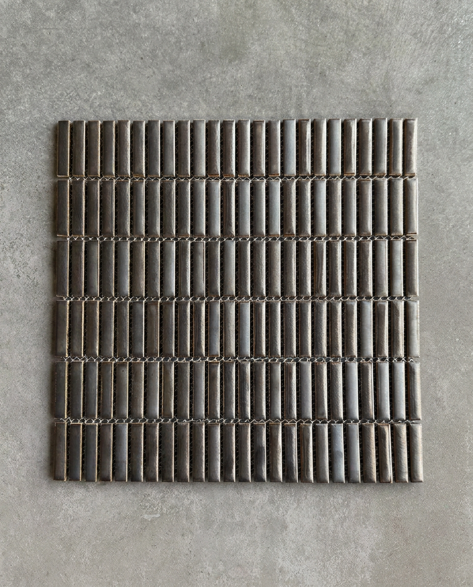 CHIBI Smoke Silver is a handcrafted Japanese mosaic stick tile with softly variegated glazes and refined texture, designed to bring depth, detail, and tactile character to contemporary interiors.