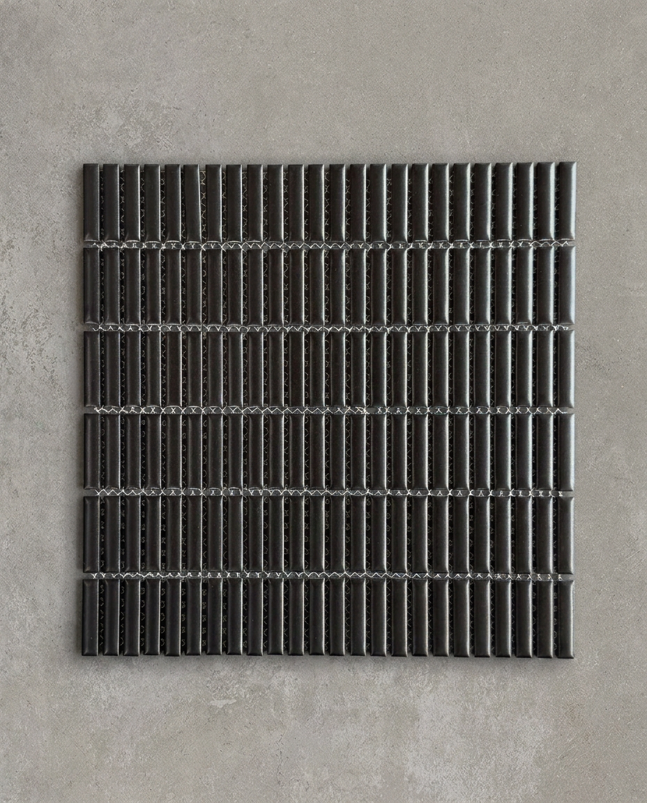 CHIBI Matt Black is a handcrafted Japanese mosaic stick tile with softly variegated glazes and refined texture, designed to bring depth, detail, and tactile character to contemporary interiors.