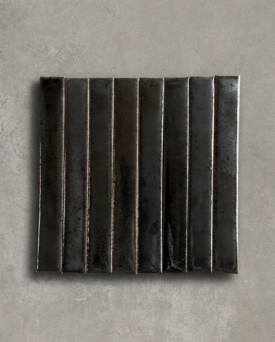 TSUKI Oil is a handcrafted Japanese ceramic wall tile with a slim profile and richly variegated glaze, bringing depth, warmth, and refined elegance to contemporary interiors.
