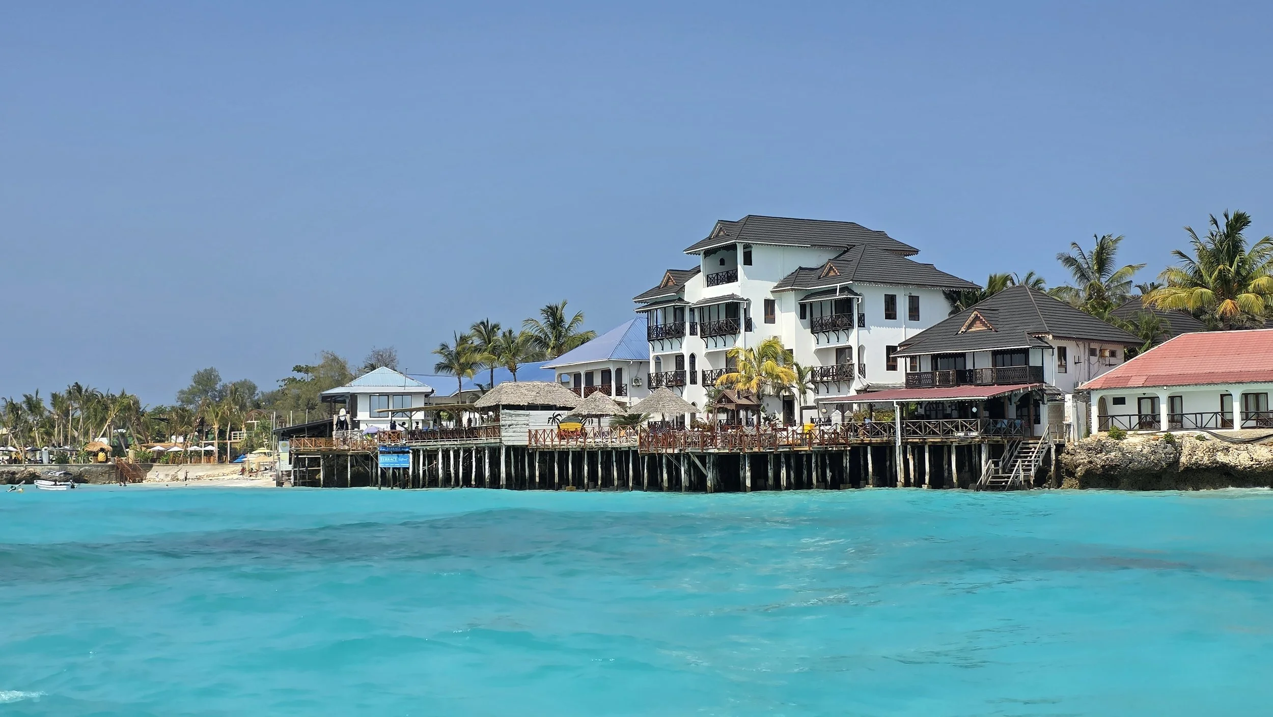 Beach view of Nungwi in Zanzibar showing hotels, bars and restaurants lining the shoreline
