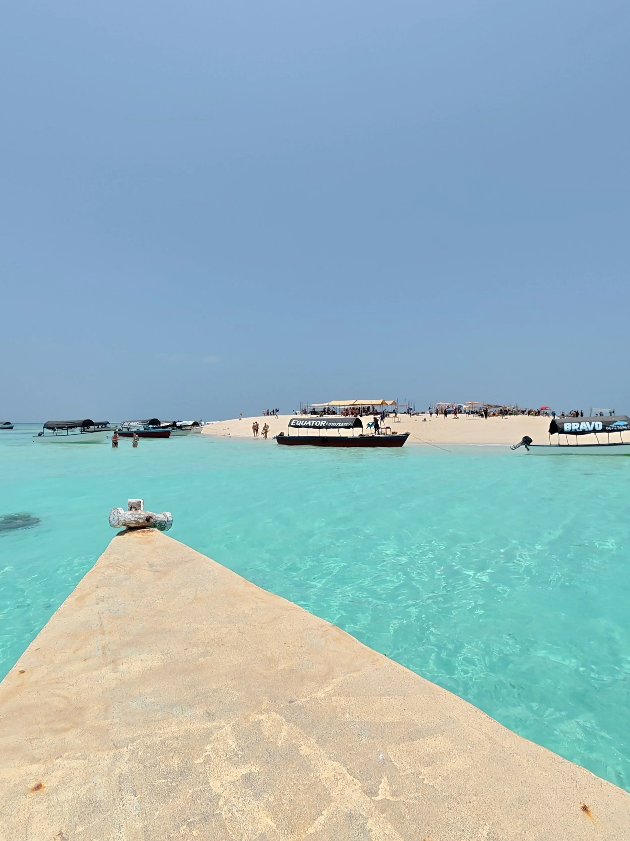 Nakupenda sandbank in Zanzibar at low tide, a white sand strip surrounded by shallow turquoise water
