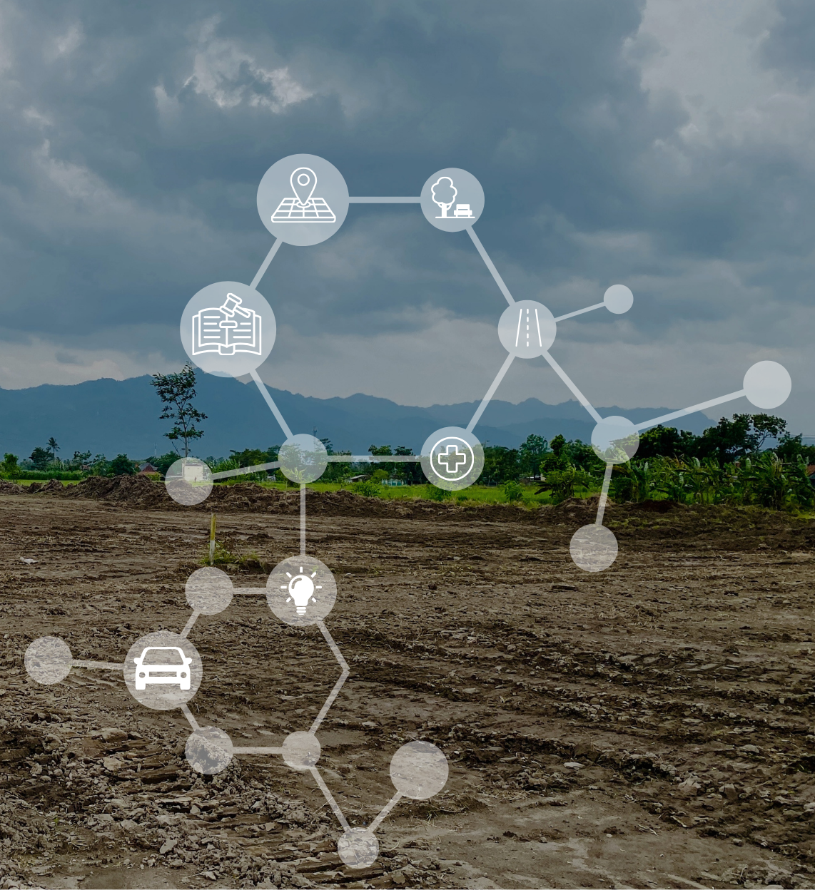 Overcast rural landscape with dirt field, green trees, mountains in the background, and overlay of interconnected icons representing geography, environment, healthcare, transportation, energy, and technology.